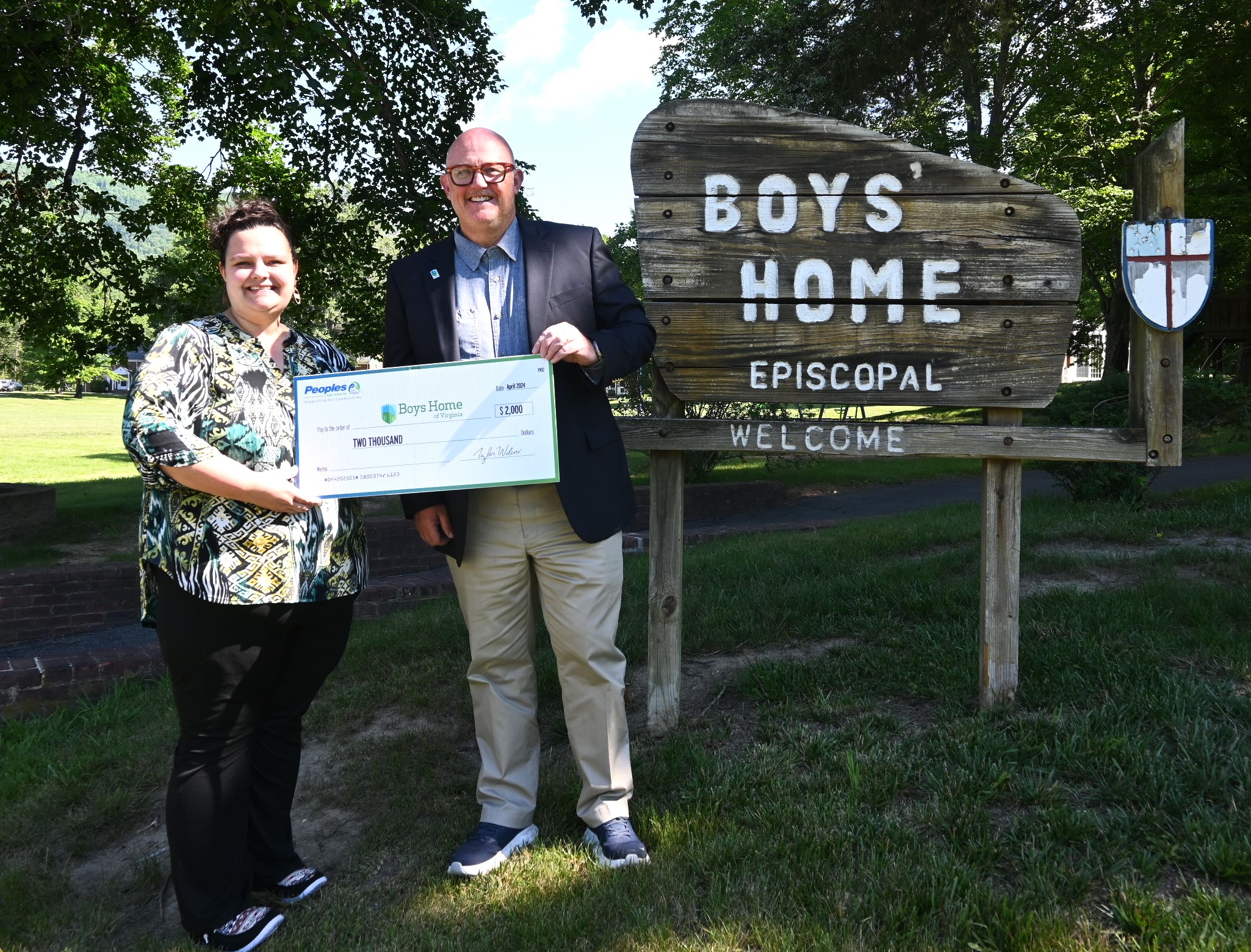 Pictured above are Afton Griffin, Branch Manager at Peoples Bank in Covington, and Chris Doyle, Executive Director of Boys Home