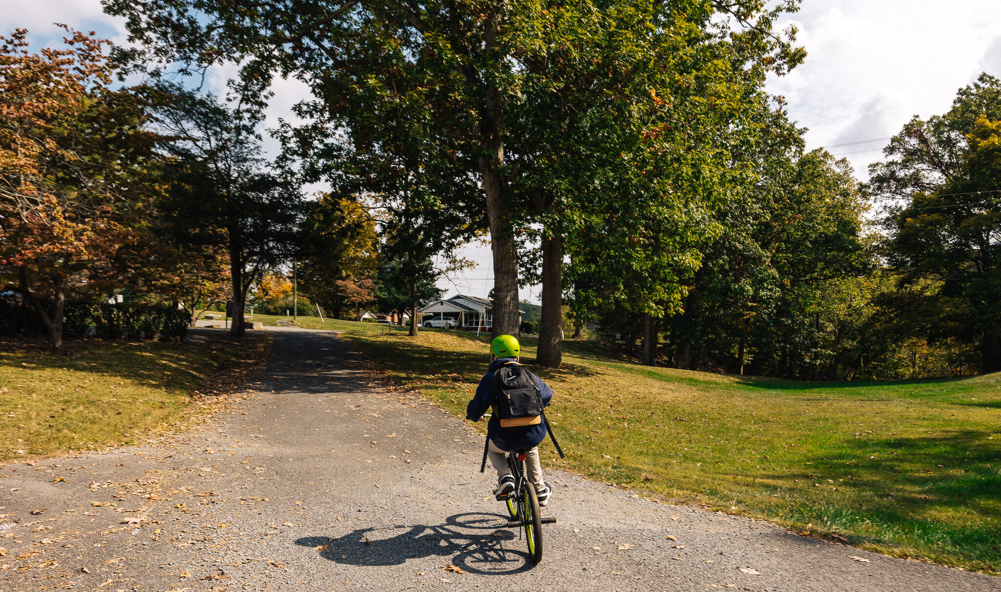 students on bike going up a hill