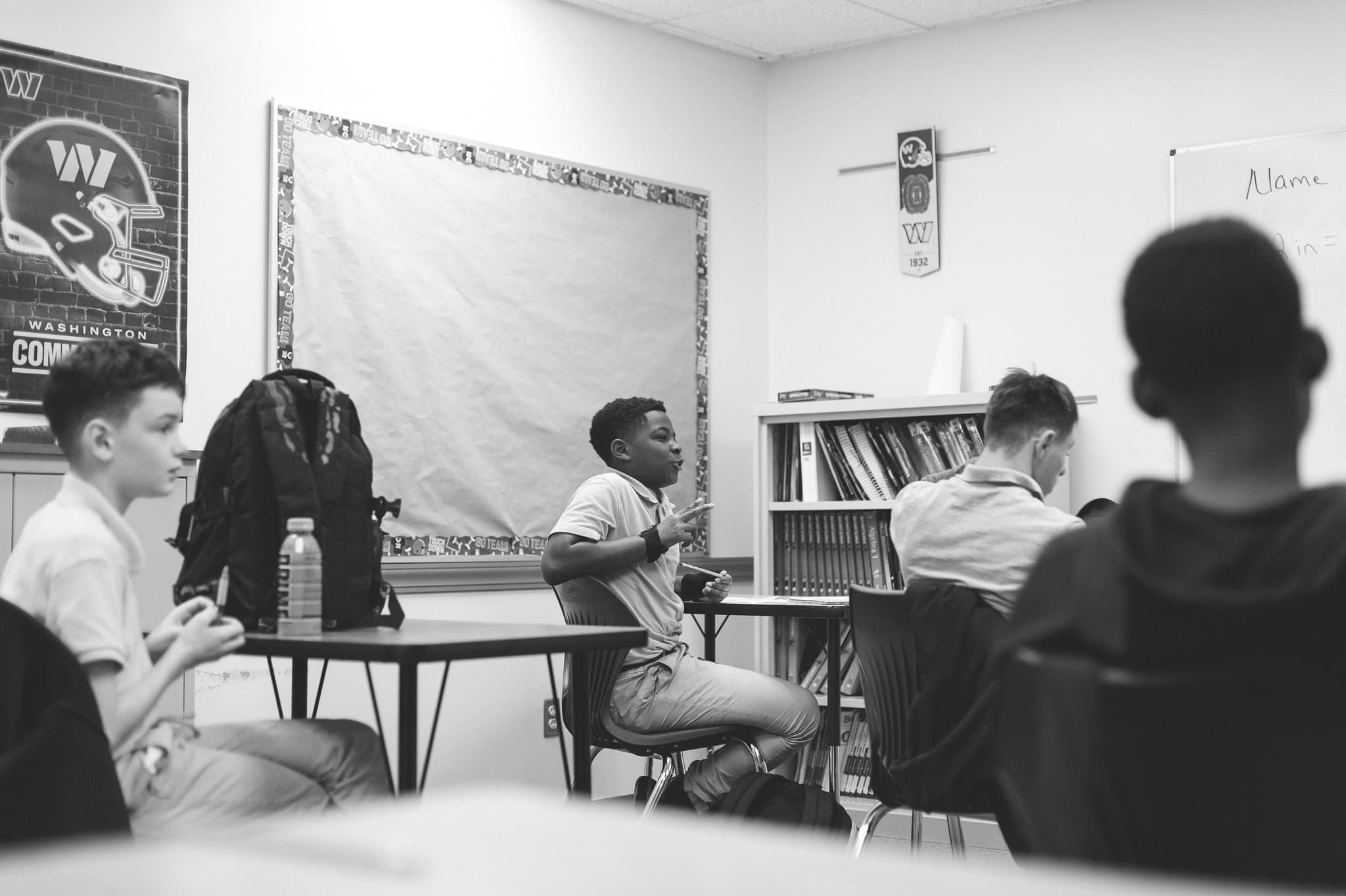 students in the classroom talking and learning